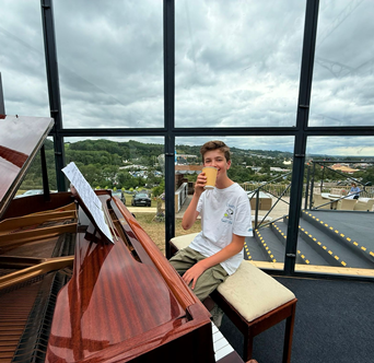 Bergie sitting at the piano